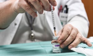 A healthworker prepares a dose of the Oxford/AstraZeneca vaccine