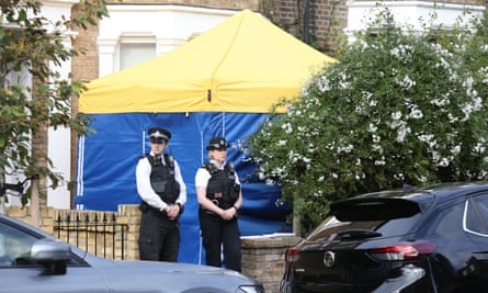 Police outside a house in north London thought to be linked to the suspect