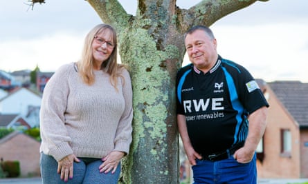 ‘My friends still sing Sue Pollard’s theme song to me’ … Marc and Karen Adams-Jones at their home in Cardiff.