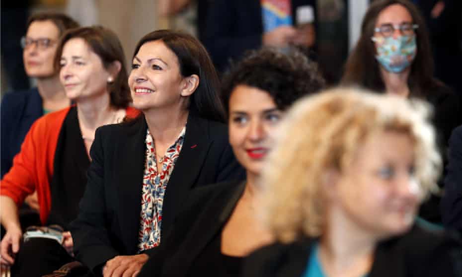 Anne Hidalgo, the mayor of Paris, centre left, with several female colleagues at a council meeting