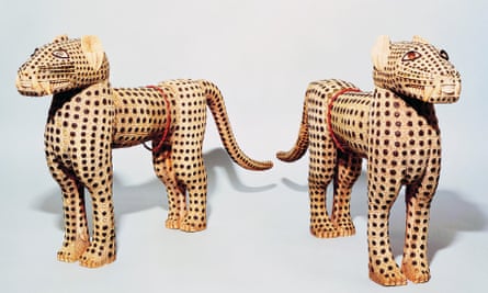 The pair of leopards, made from ivory with metal inlay, looted from the kingdom of Benin