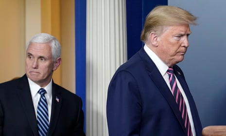A grim-faced Donald Trump arrives with Vice-President Mike Pence to address an uncharacteristically curt coronavirus taskforce media briefing on Friday.