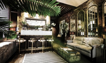 The palm-dotted cocktail lounge at Cow Hollow Hotel, Manchester