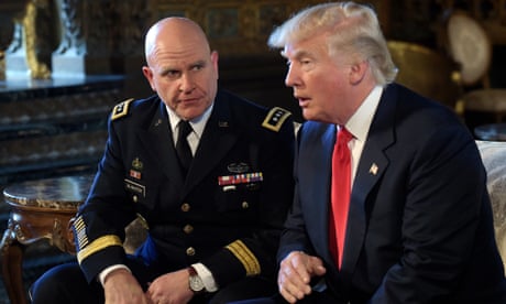 a man in a suit and tie speaks next to a man in a military uniform