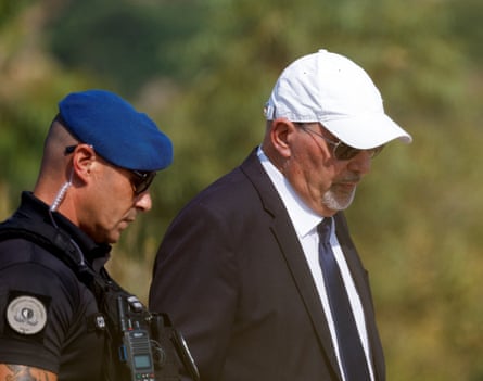 Vincent Muscat in a suit and white cap