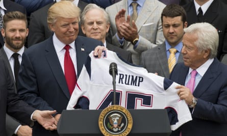 Kraft gives Trump a New England Patriots jersey at the White House in April after their Super Bowl win.