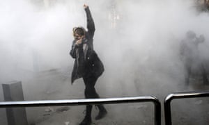 Riot police use smoke grenades against students at Tehran University during a demonstration at the weekend.