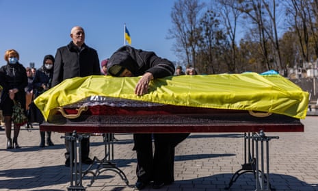 Luba and Volodymyr Skrypnuk lay their son Ivan to rest in Lviv, Ukraine.