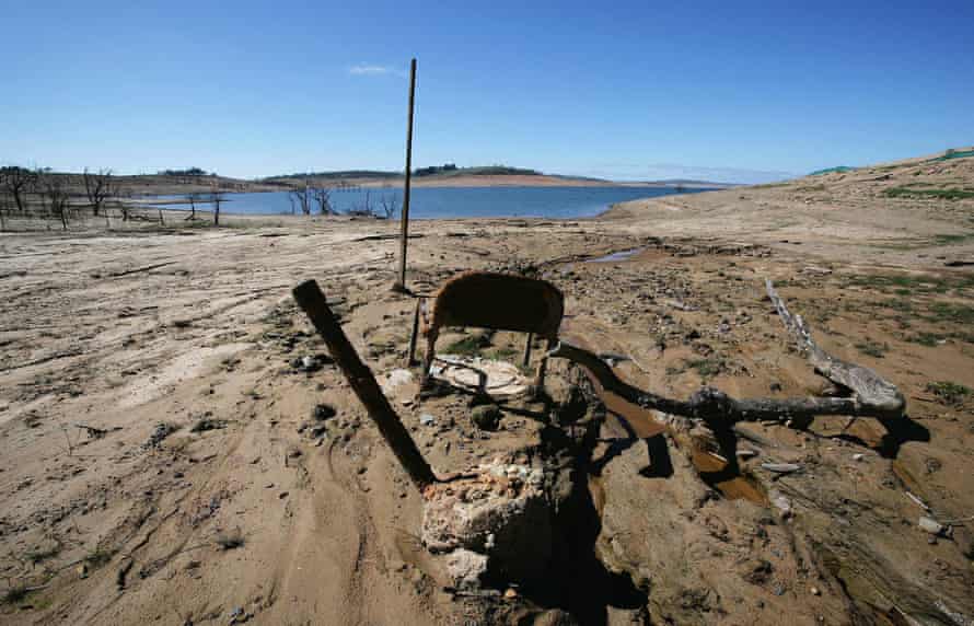 An old chair sticks out of the mud on the shore line of Lake Eucumbene at Old Adaminaby, a town that was flooded as part of the Snowy Mountains Hydro Electric scheme in 1956.