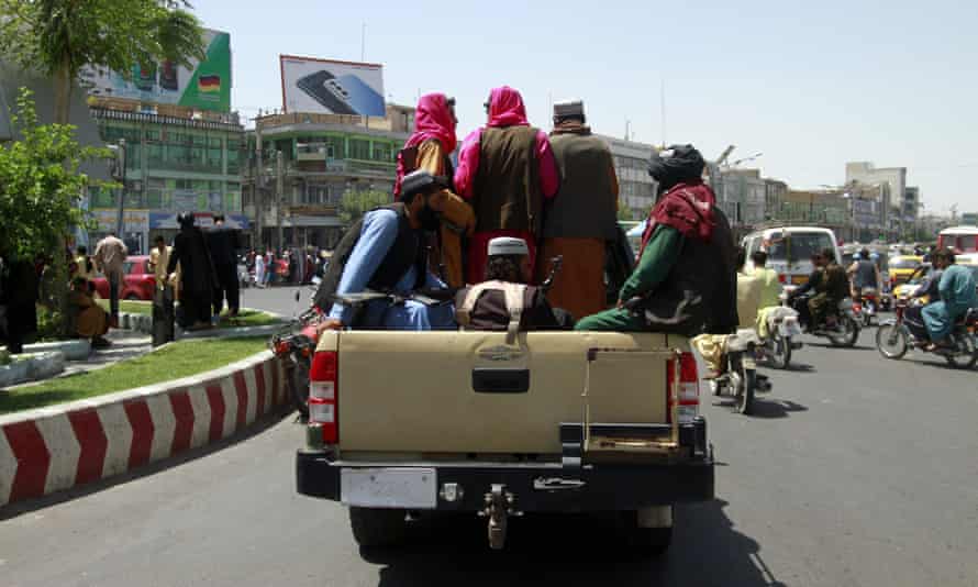 Taliban fighters on the back of a truck in Herat on 14 August, the day after they took the city from the Afghan government.