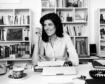 Susan Sontag at her desk, smoking, in 1972.