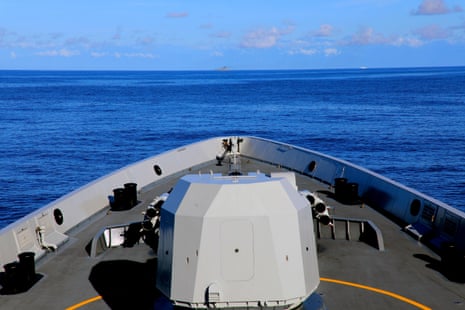A view from the bow of a Chinese warship on flat seas