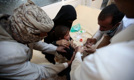 A girl is treated for a suspected cholera infection in Sanaa, Yemen