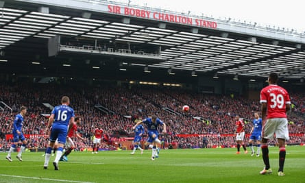 The Sir Bobby Charlton stand with players on the pitch in the foreground