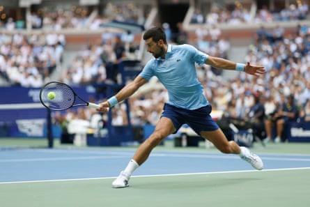 Novak Djokovic hits a backhand.