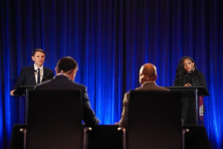 a women and a man facing two men