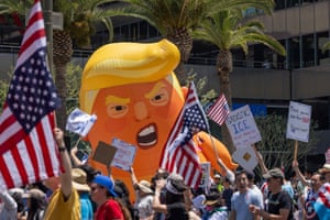 people hold signs and flags