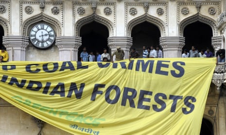 Police pull down a Greenpeace protest banner in Hyderabad in 2012.