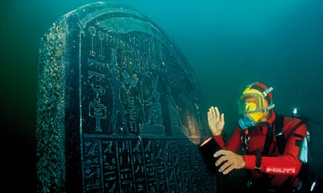 A diver with a large tablet carrying a royal decree from the pharaoh Nectanebo I, which will feature in the British Museum exhibition.