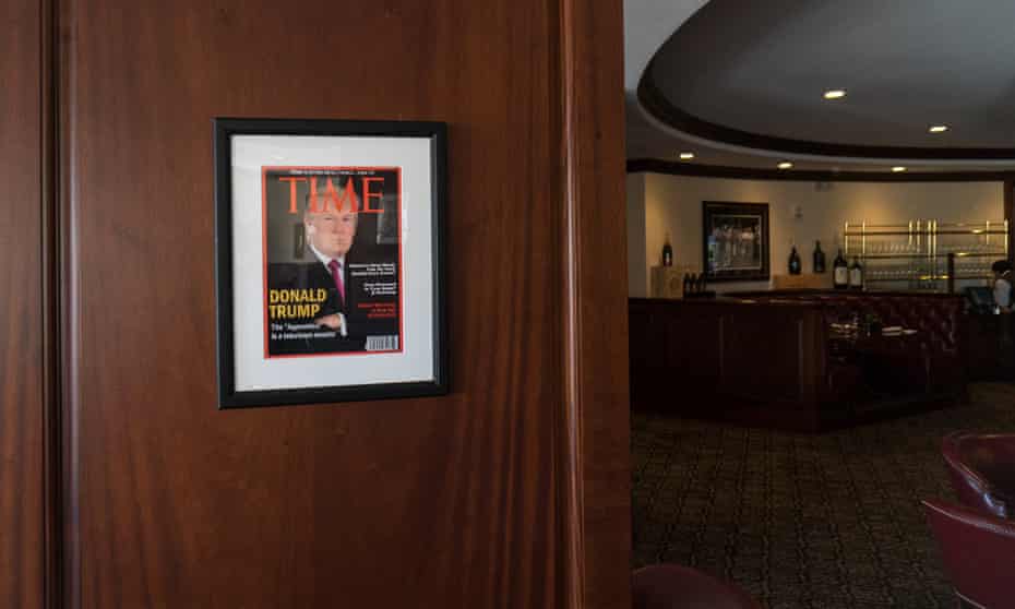Framed portrait of President Donald Trump on the cover of a Time Magazine hanging from a column in the Champions Sports Bar &amp; Grill at the Trump National Doral Miami.