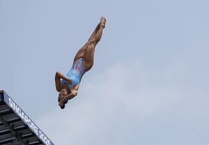 An upside-down diver leaps