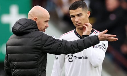 The Manchester United manager, Erik ten Hag, talks to Cristiano Ronaldo.