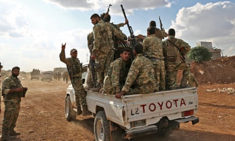 Turkish-backed Syrian fighters near Aleppo on October 7, 2019. - US forces in northern Syria started pulling back from areas along the Turkish border ahead of a feared military invasion by Ankara that Kurdish forces say would spark a jihadist resurgence. The Kurdish-led Syrian Democratic Forces said in a statement that “US forces withdrew from the border areas with Turkey” in northeast Syria. (Photo by Nazeer Al-khatib / AFP) (Photo by NAZEER AL-KHATIB/AFP via Getty Images)