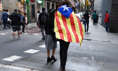 A man draped in a Catalan independence flag in Barcelona on the day of the referendum.