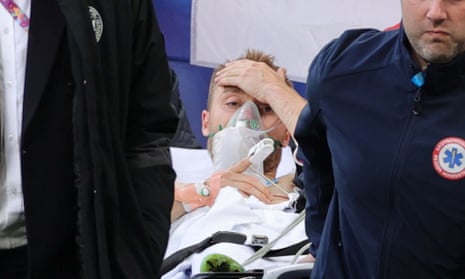 Christian Eriksen is carried off after collapsing during Denmark’s Euro 2020 match with Finland in Copenhagen.