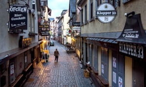 A man walks through the main party spot in the Alt-Sachsenhausen district in Frankfurt, Germany, Sunday, 21 March 2021. On Monday German politicos will discuss further measures to avoid the spread of the coronavirus.