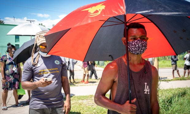 Port Moresby residents line up outiside the Rita Flynn Sports Complex which has been set up as a Covid testing point in Papua New Guinea’s capital as the coronavirus outbreak worsens.