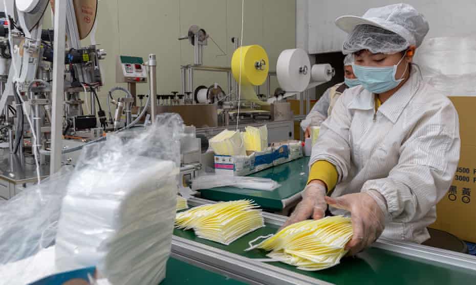 Workers sorting face masks inside a factory in New Taipei city, Taiwan.