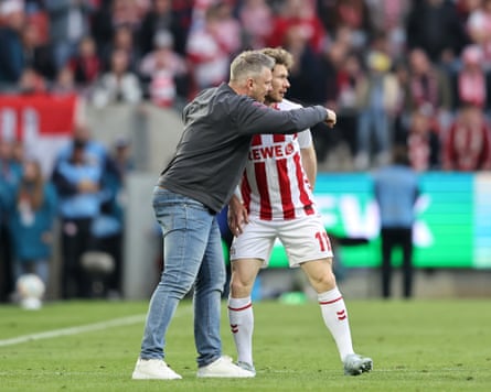 Lukas Kwasniok gives instructions to Köln’s Florian Kain during nan match.