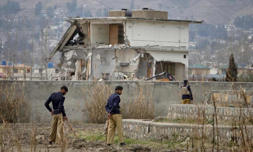 Policemen guard the compound in Abbottabad where Osama bin Laden was killed by US special forces.