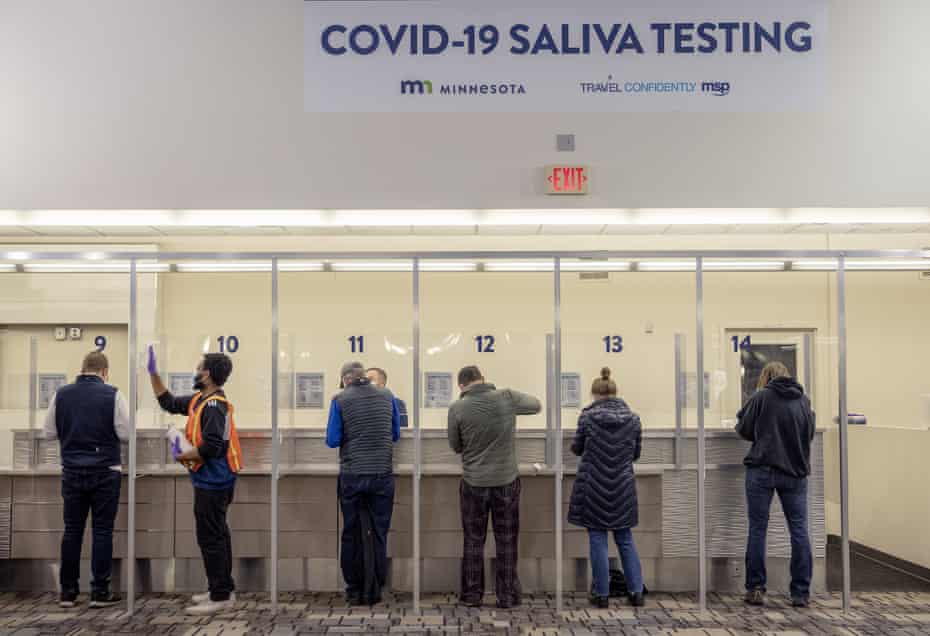 People get tested at the new saliva Covid-19 testing site at the Minneapolis-St Paul international airport. 