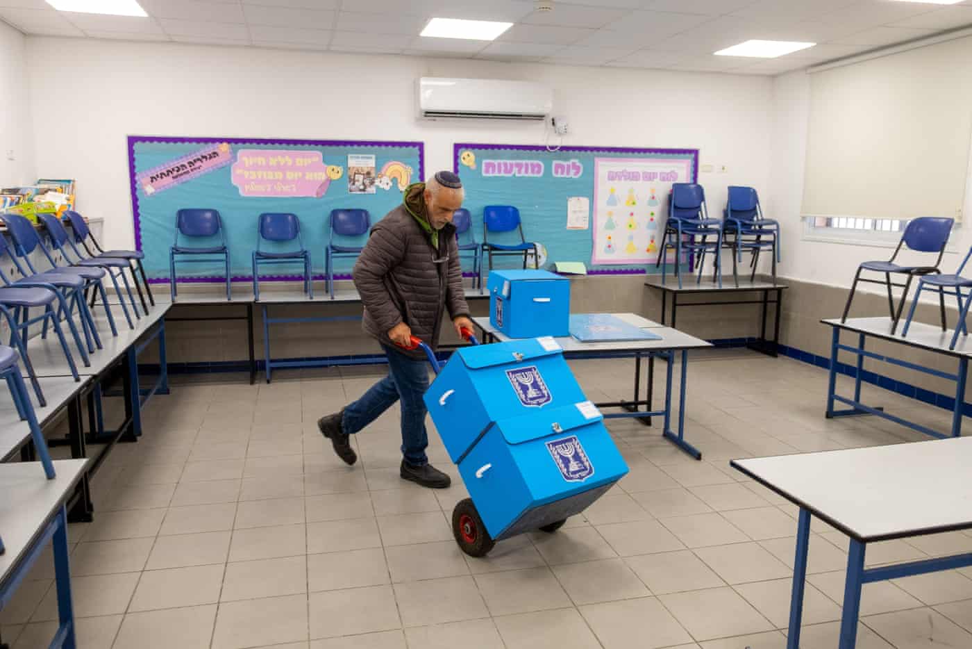 Ballot boxes are set up at a school in Tel Aviv.