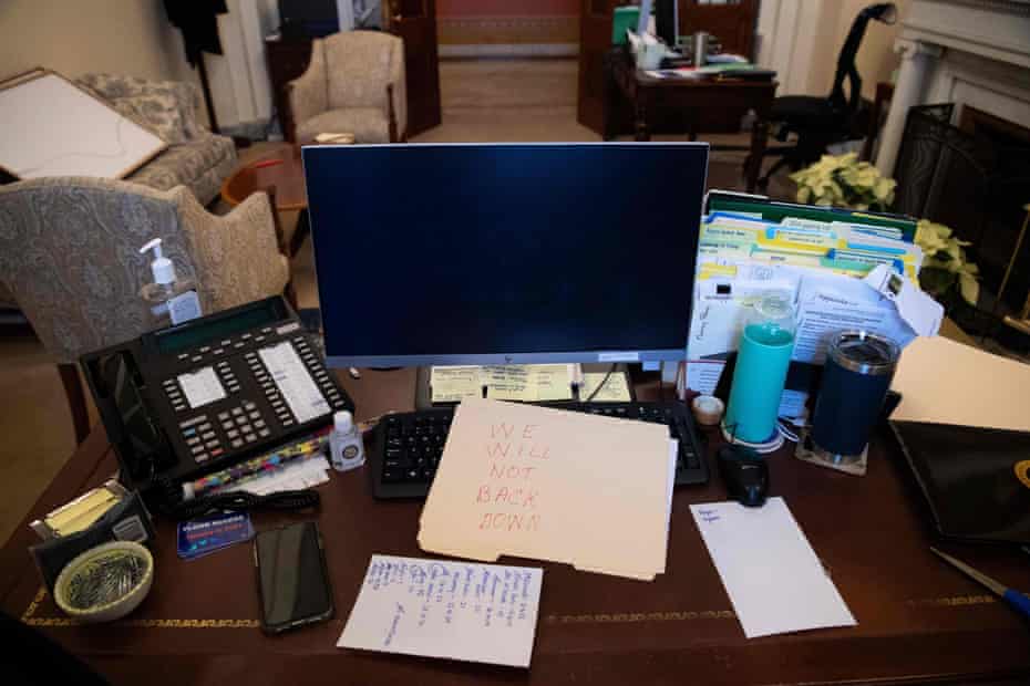 A Trump supporter leaves a note at Nancy Pelosi's office.