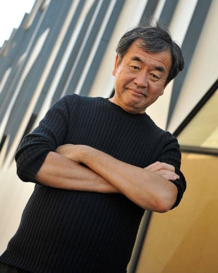 Kengo Kuma looking at the camera with his arms folded