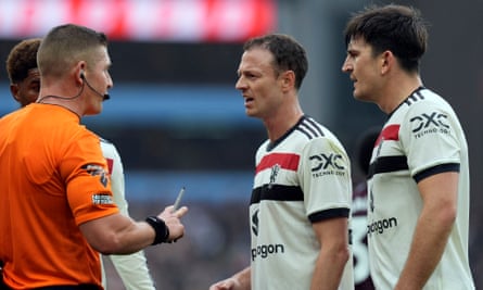 Jonny Evans and Harry Maguire talk to the referee