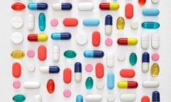 Pills and capsules against a white background