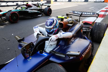 Franco Colapinto climbs out of his Williams after crashing in Baku.