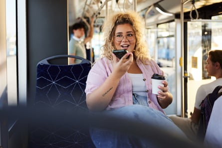 Woman on a bus talking into her phone