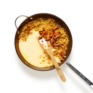 Whisk the eggs and cream, stir into the onion mix with fried lardons, then season and add grated nutmeg.