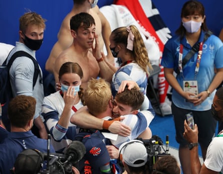 Tom Daley and Matty Lee celebrate winning gold in Tokyo.