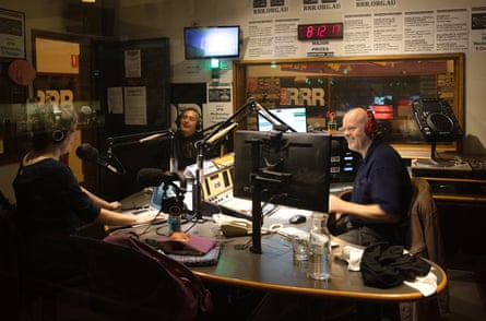 Clem Bastow, Christos Tsiolkas and Casey Bennetto sitting in a radio studio. They have headphones on and are talking into microphones