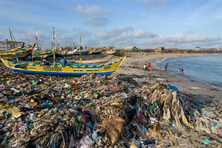 Plastic and fast fashion waste choke a fish landing beach, Accra, Ghana