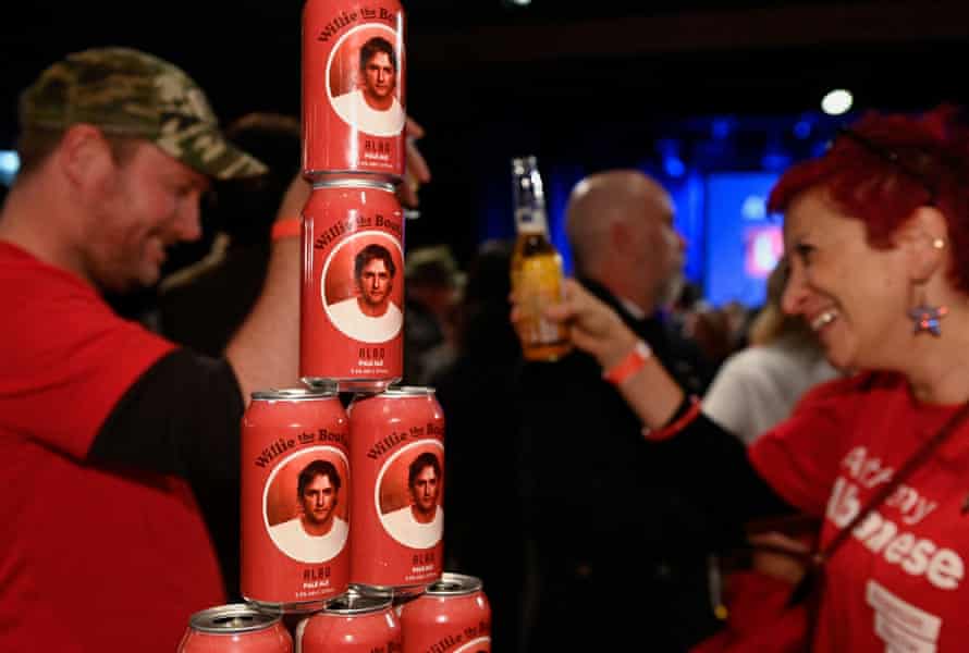 A pyramid of Albo ale is stacked on a table.