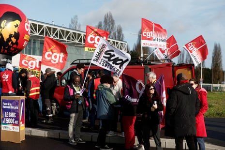 French CGT union members demonstrating in front of the Amazon logistics center in Bretigny-sur-Orge, near Paris, as part of a global day of actions against Amazon on Black Friday.