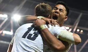 Henry Slade of England celebrates with Manu Tuilagi after scoring his side’s third try in Dublin.