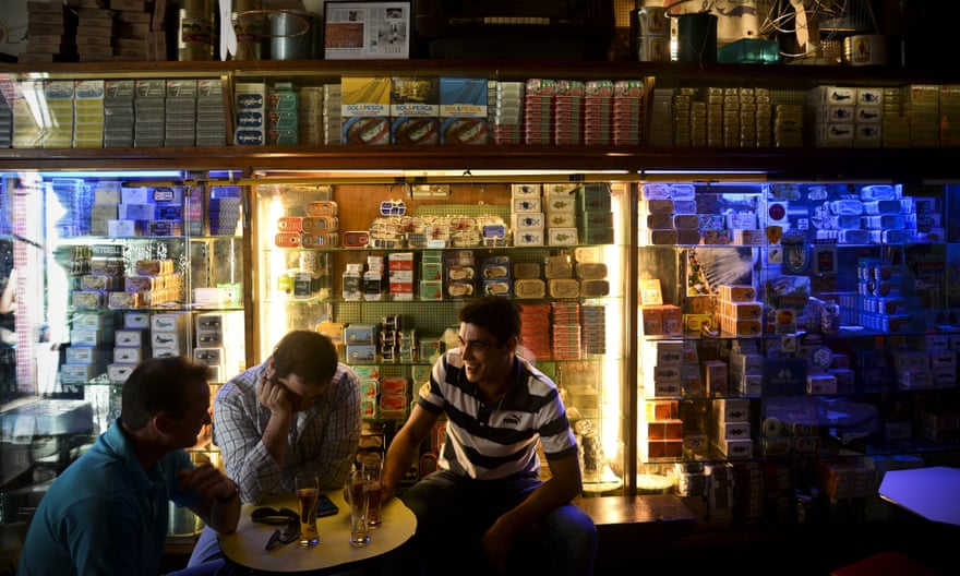 People sit at the traditional canned fish bar Sol e Pesca at Cais do Sodre in Lisbon, Portugal